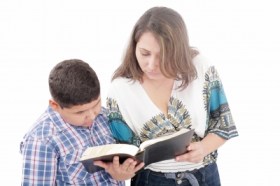 Mother and son reading the bible by David Castillo Dominici/Freedigitalphotos.net